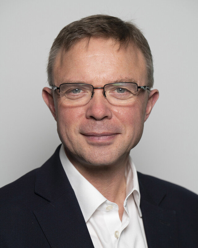 A head and shoulders portrait photograph of RCR president Stephen Harding