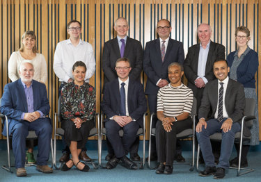 A group portrait of the RCR trustees for autumn 2025, five people standing and sitting