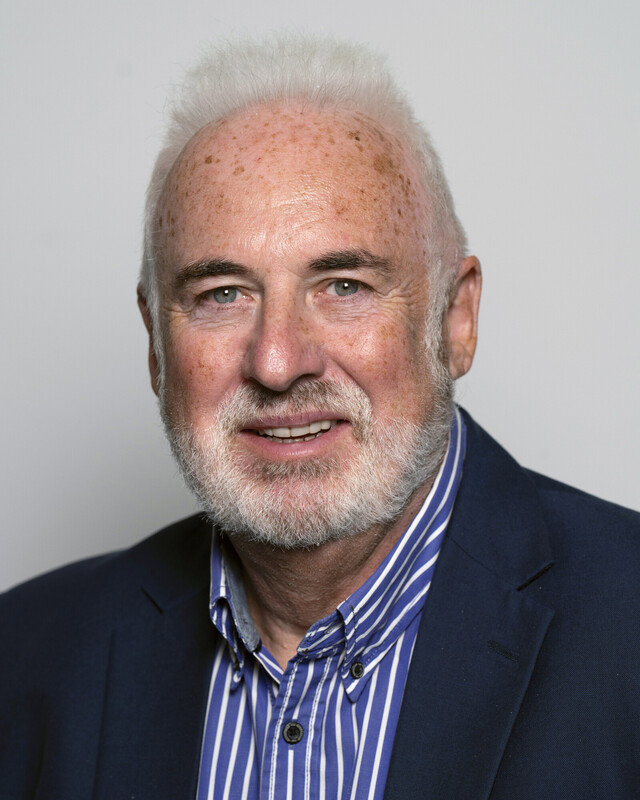 A head and shoulders portrait of Mr John Coughlan