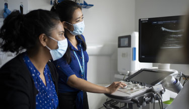 Trainee and consultant radiologists, conducting an ultrasound consultation