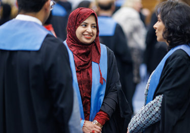 Three new Fellows talking at an RCR admissions ceremony.