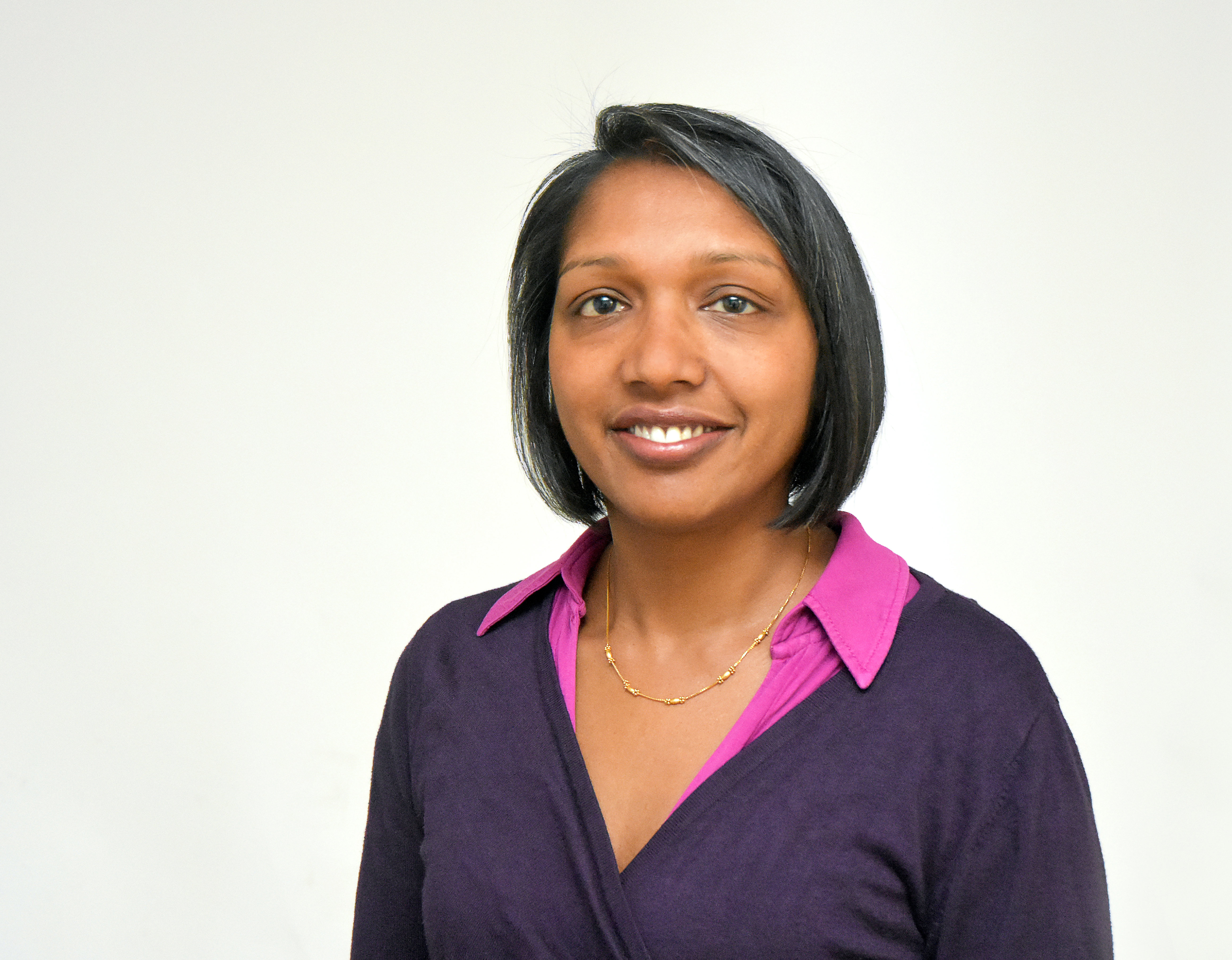 A head and shoulders portrait of a woman, Dr Lakshmi Ratnam, an interventional radiologist