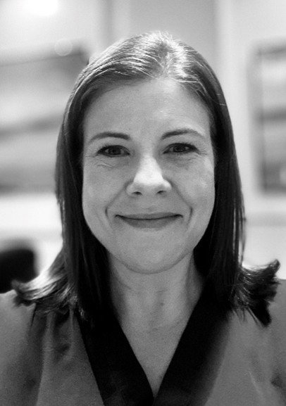 A head and shoulders portrait of a woman, Dr Hannah Stockley, an interventional radiologist